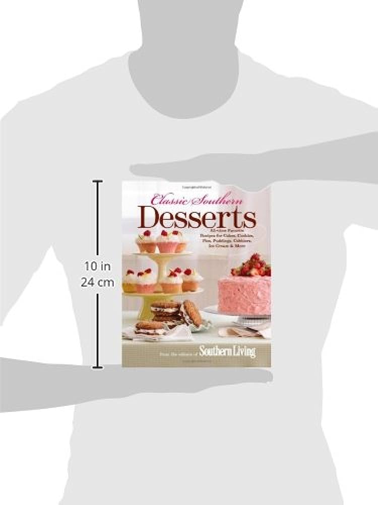 "Classic Southern Desserts" cookbook cover held by person, 10 inches tall (24 cm), featuring cakes, cupcakes, and cookies.