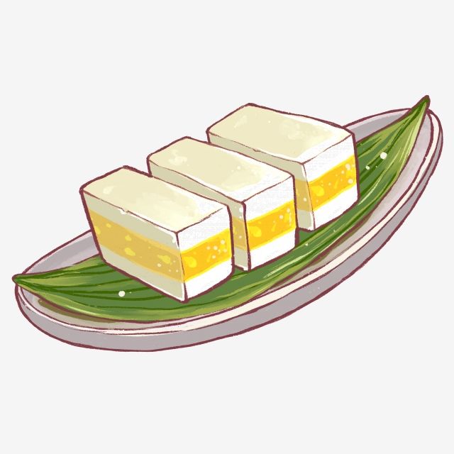 Three square pieces of layered yellow-and-white dessert on a green leaf, served on an oval plate.