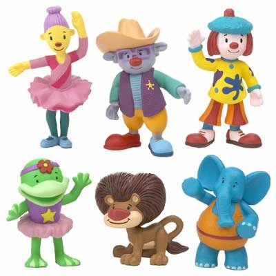 Six colorful plastic toy figures including clowns, a ballerina frog, a lion, and an elephant, arranged on a white background.