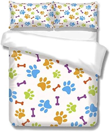 Colorful pet-themed duvet cover and pillowcases with paw prints and bones on white background.