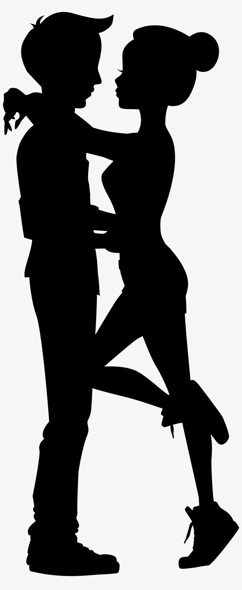 Silhouette of a romantic couple dancing closely, man and woman in profile, intimate pose with one leg lifted.