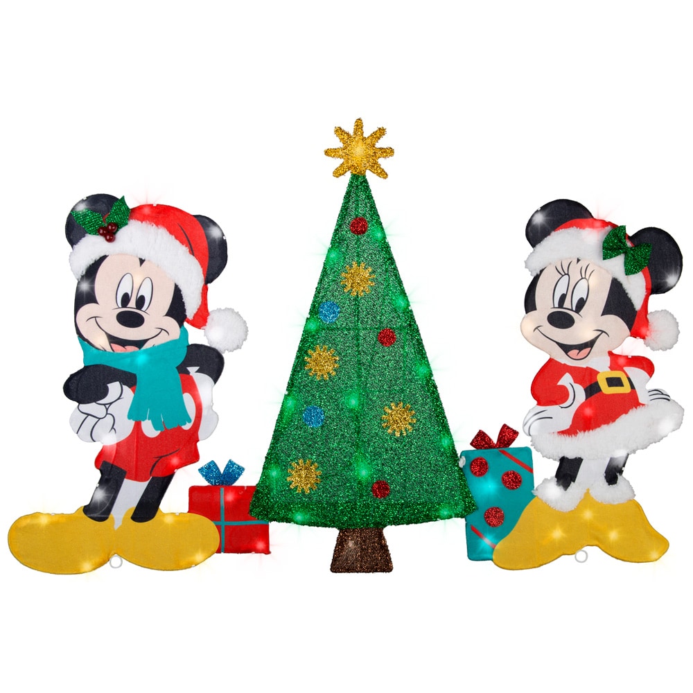 Mickey and Minnie Mouse in festive Santa outfits flanking a glittering Christmas tree with gifts and lights.