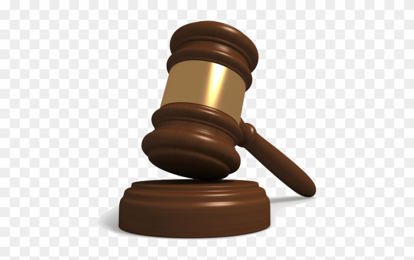 Wooden judge's gavel resting on its sound block, symbolizing legal authority and justice.