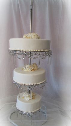 Elegant 3-Tier White Wedding Cake with Silver Accents & Floral Details