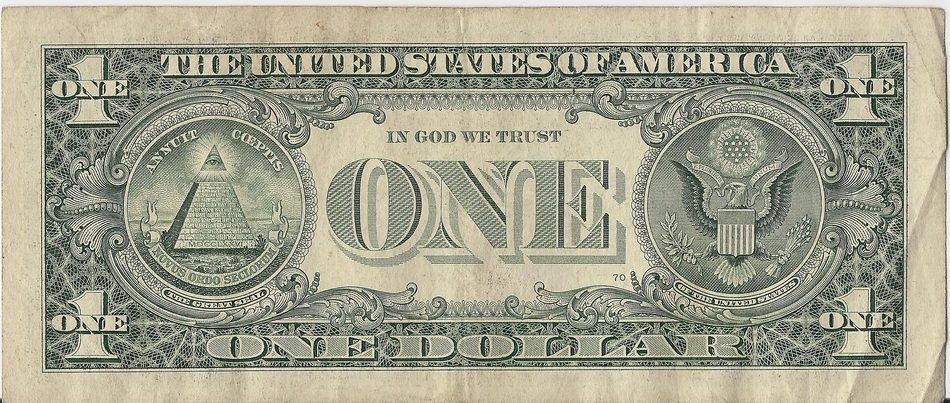 Back of a U.S. one-dollar bill featuring the Great Seal with pyramid, eye, and eagle.