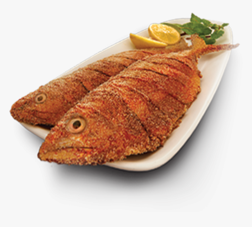 Two golden-brown fried whole fish served on a white platter with lemon wedges and fresh mint.