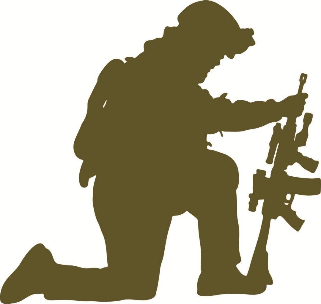 Silhouette of a kneeling soldier in combat gear inspecting an assault rifle.