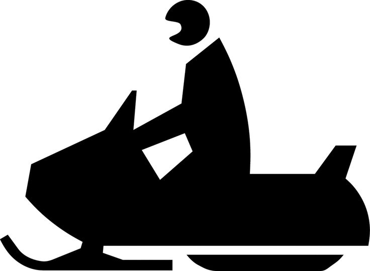 Silhouette of a person wearing a helmet riding a snowmobile.