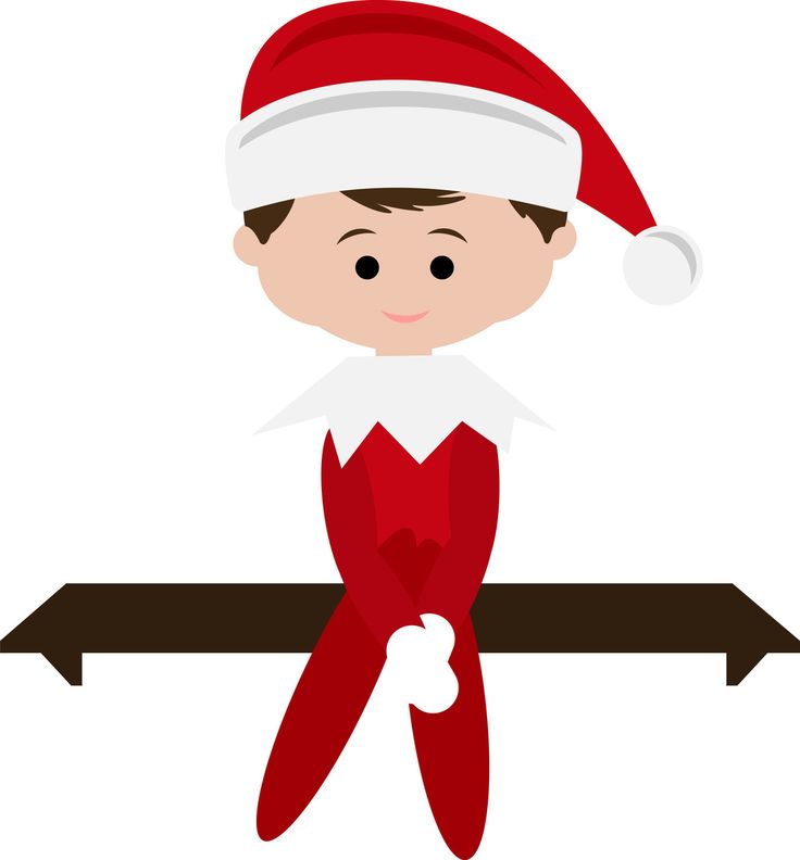 A smiling elf in a red suit and Santa hat sits on a wooden shelf, hands clasped, ready for holiday fun.