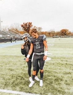 High School Football Players Posing on Field After Practice