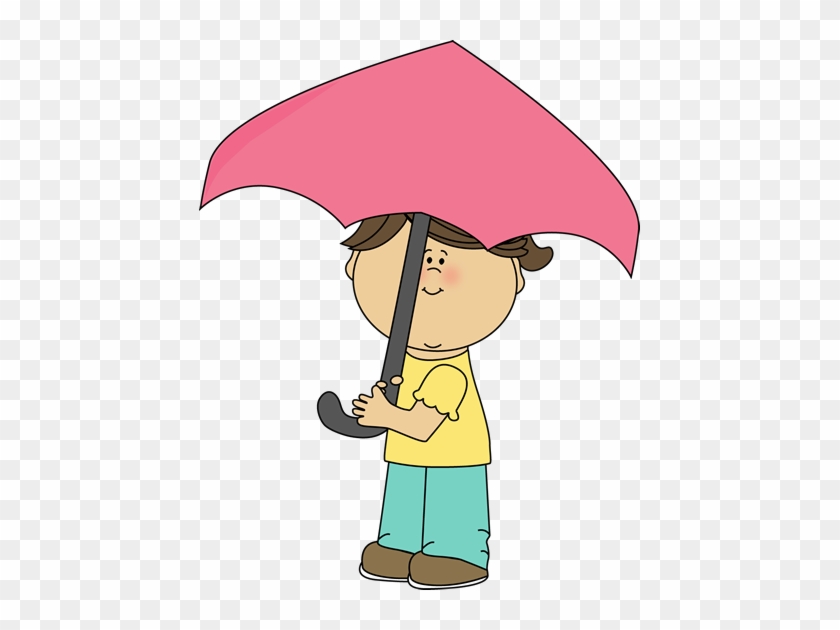 Child holding a pink umbrella, wearing yellow shirt and teal pants, smiling gently.