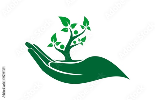 Green hand cradling a growing tree with leaves and human silhouettes, symbolizing care for nature and sustainability.