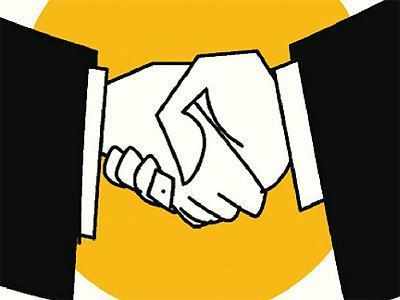 Two hands in formal attire shaking against a yellow background, symbolizing agreement or partnership.