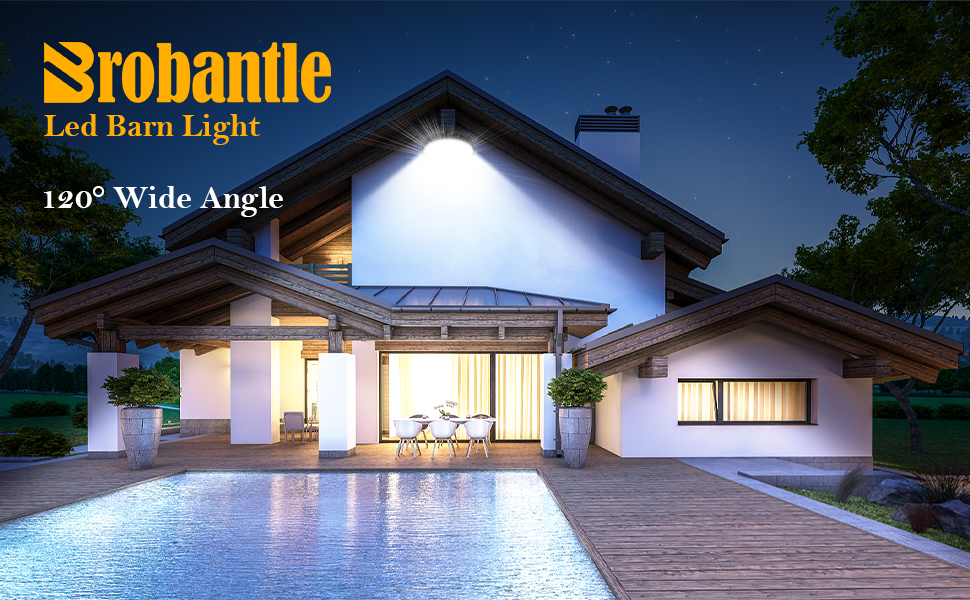 Srobantle LED barn light illuminating a modern alpine-style home at night with 120° wide-angle coverage.