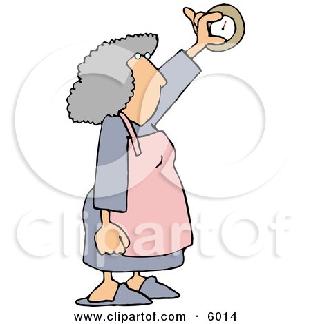 Elderly woman with gray curly hair, wearing apron, holding up a round analog clock while looking at it.