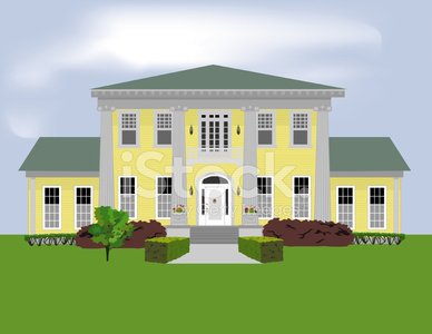 Yellow colonial-style mansion with green roof, white columns, symmetrical windows, and landscaped front yard.