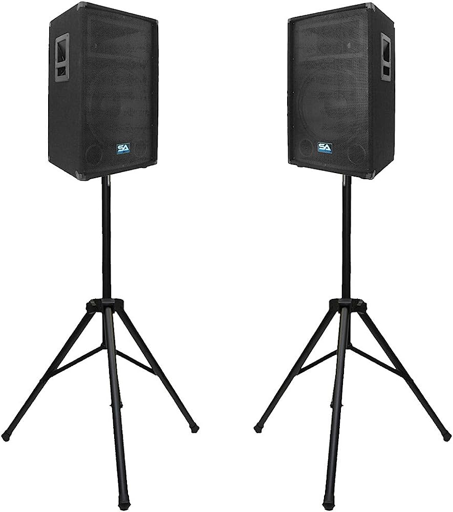 Two black SA brand PA speakers on tripod stands against white background.