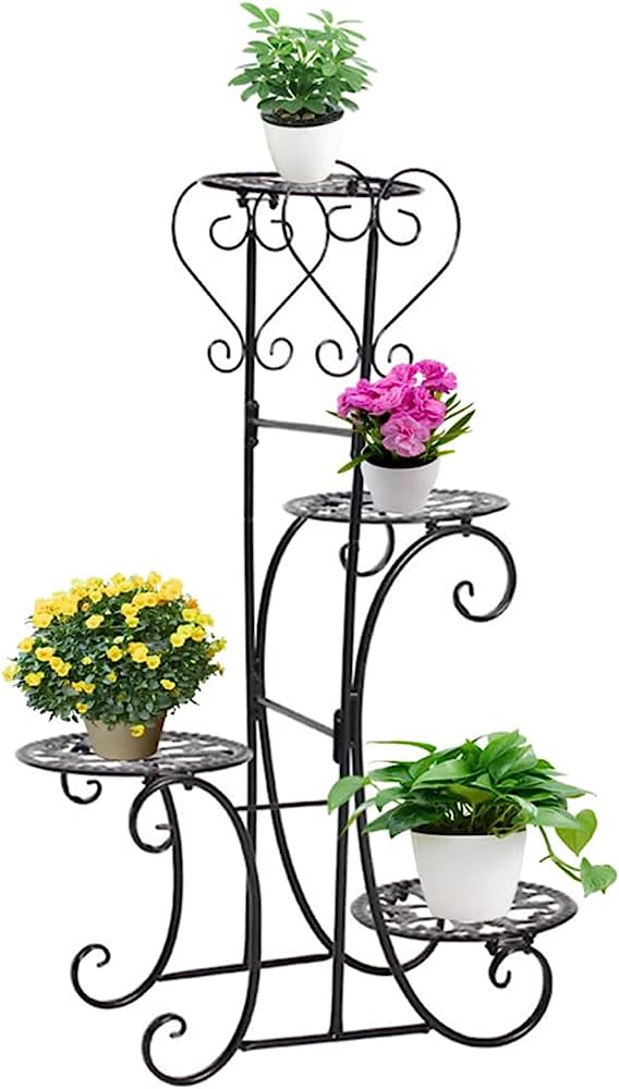 Black wrought iron 4-tier plant stand with decorative scrollwork holding potted flowers and greenery.