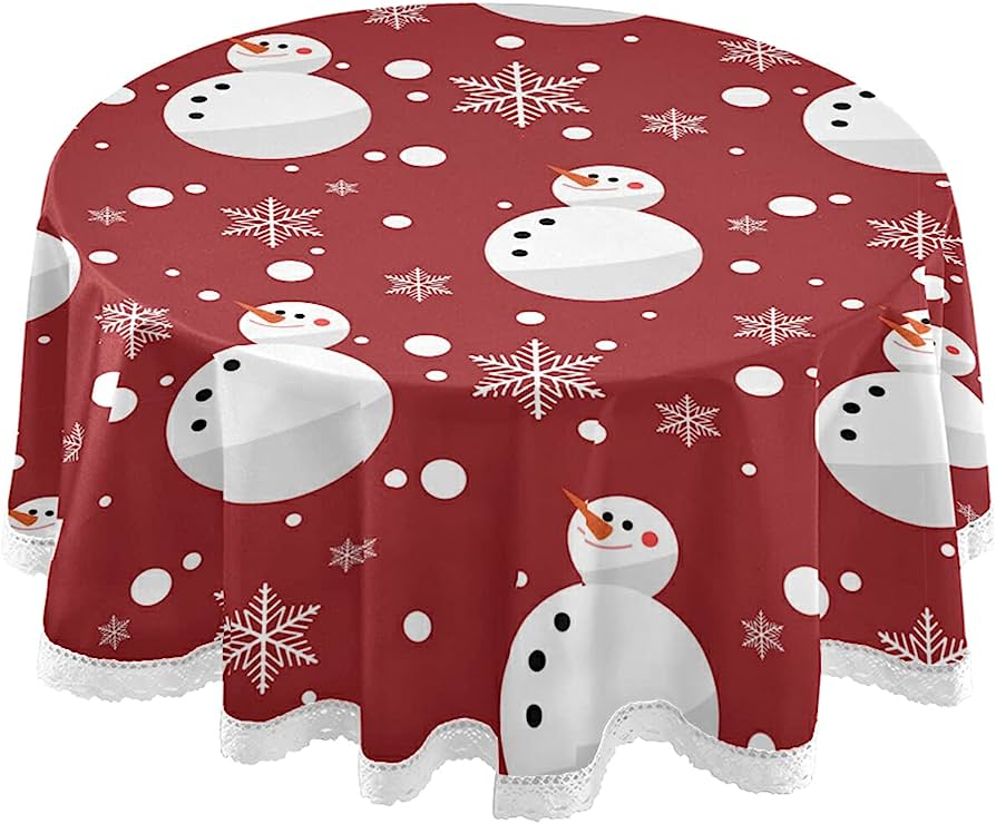 Red festive tablecloth with white snowmen, snowflakes, and polka dots, edged with lace trim.