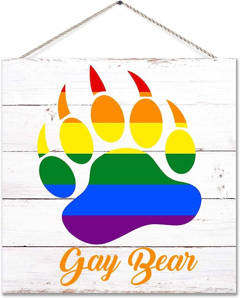 Rainbow-colored bear paw print on white wood sign with "Gay Bear" text in orange script.