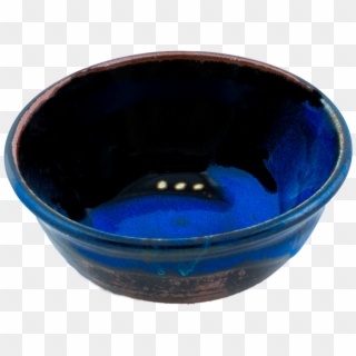 Handcrafted ceramic bowl with glossy deep blue glaze and rustic brown rim, featuring subtle gold flecks inside.