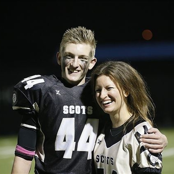 High School Football Teammates Celebrate After Game Night