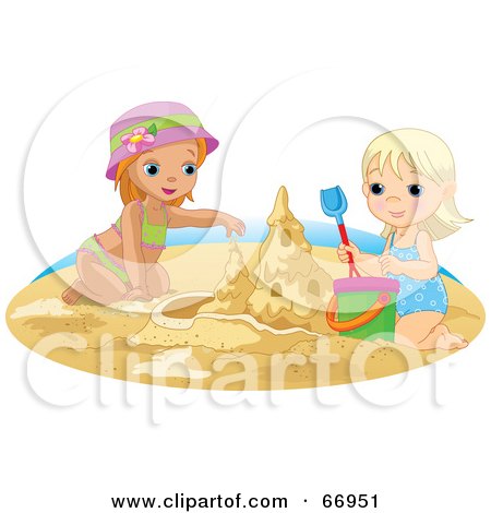 Two smiling girls building a sandcastle on the beach with buckets and shovels.