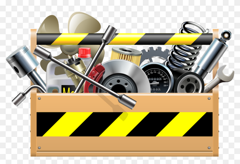 Wooden toolbox filled with automotive repair tools and parts, including wrenches, brake disc, oil filter, springs, and warning stripes.