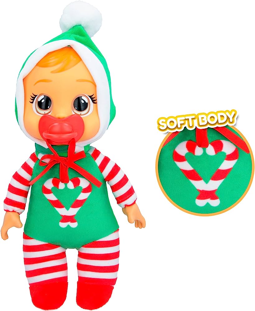 Festive baby doll in green and red striped Christmas outfit with candy cane heart design and soft body feature.