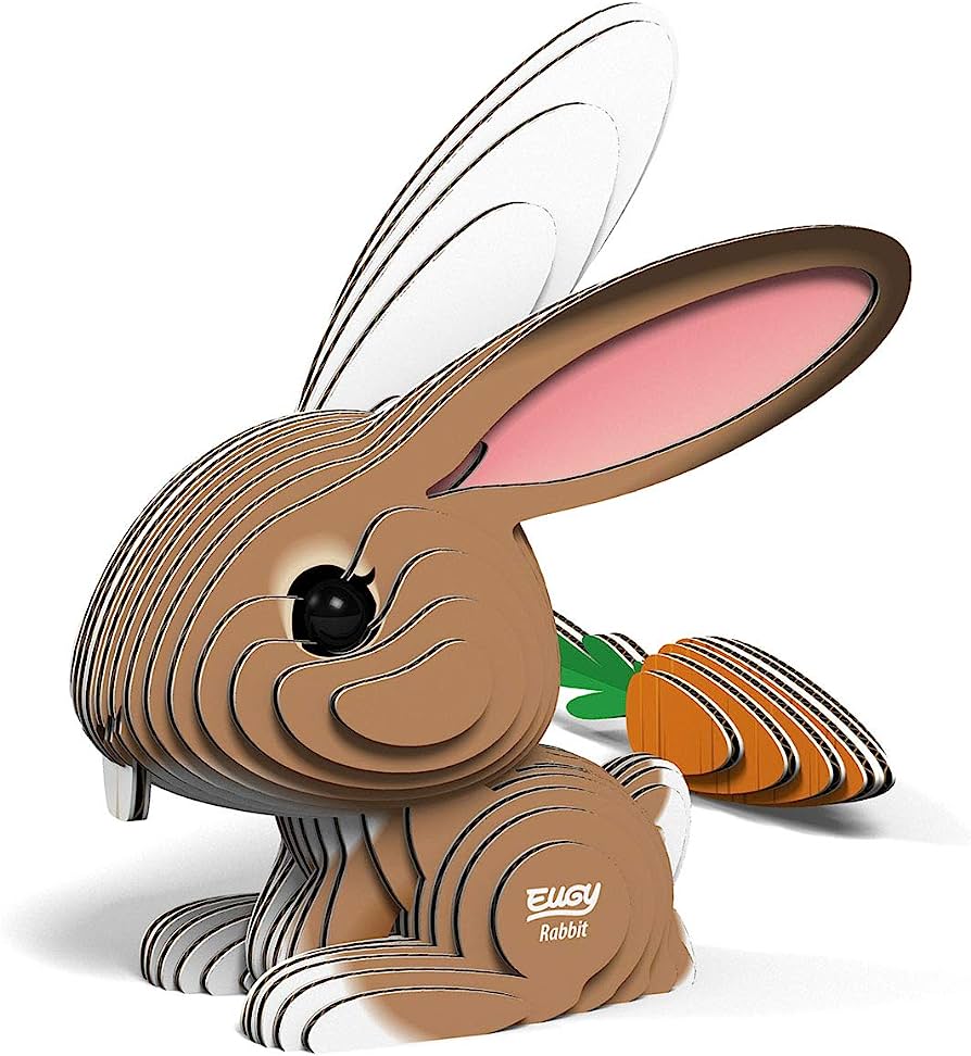 Layered paper-craft rabbit with pink inner ears, holding a carrot, branded "EUGY Rabbit".