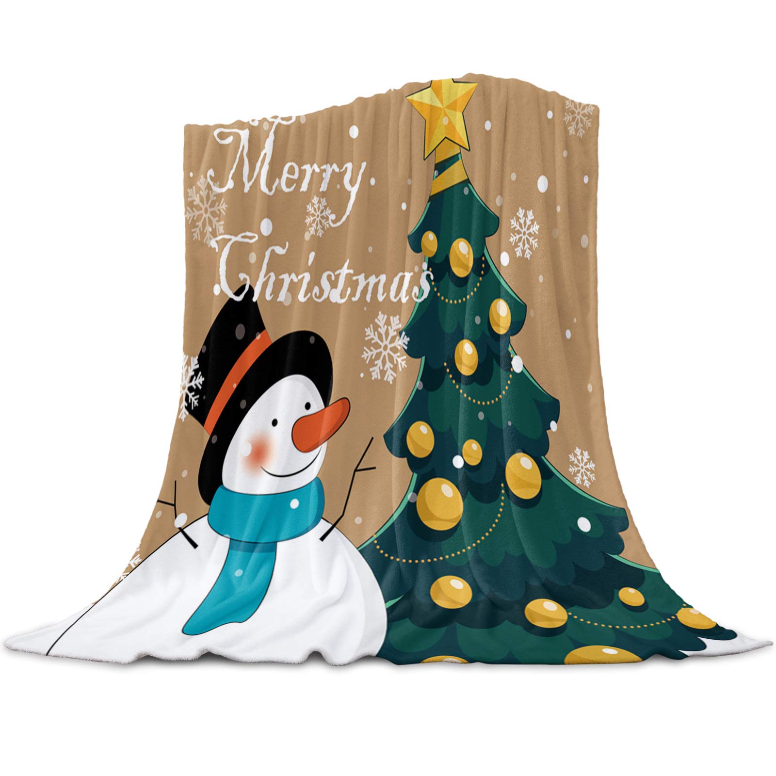 Festive Christmas blanket featuring a smiling snowman, decorated tree, and "Merry Christmas" text on beige background with snowflakes.