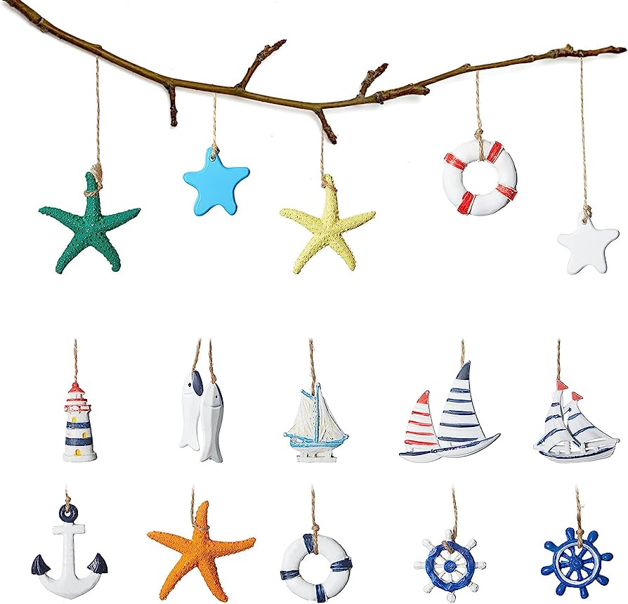 Nautical-themed ceramic ornaments including starfish, anchors, sailboats, lifebuoys, lighthouses, and ship wheels hanging from a branch.