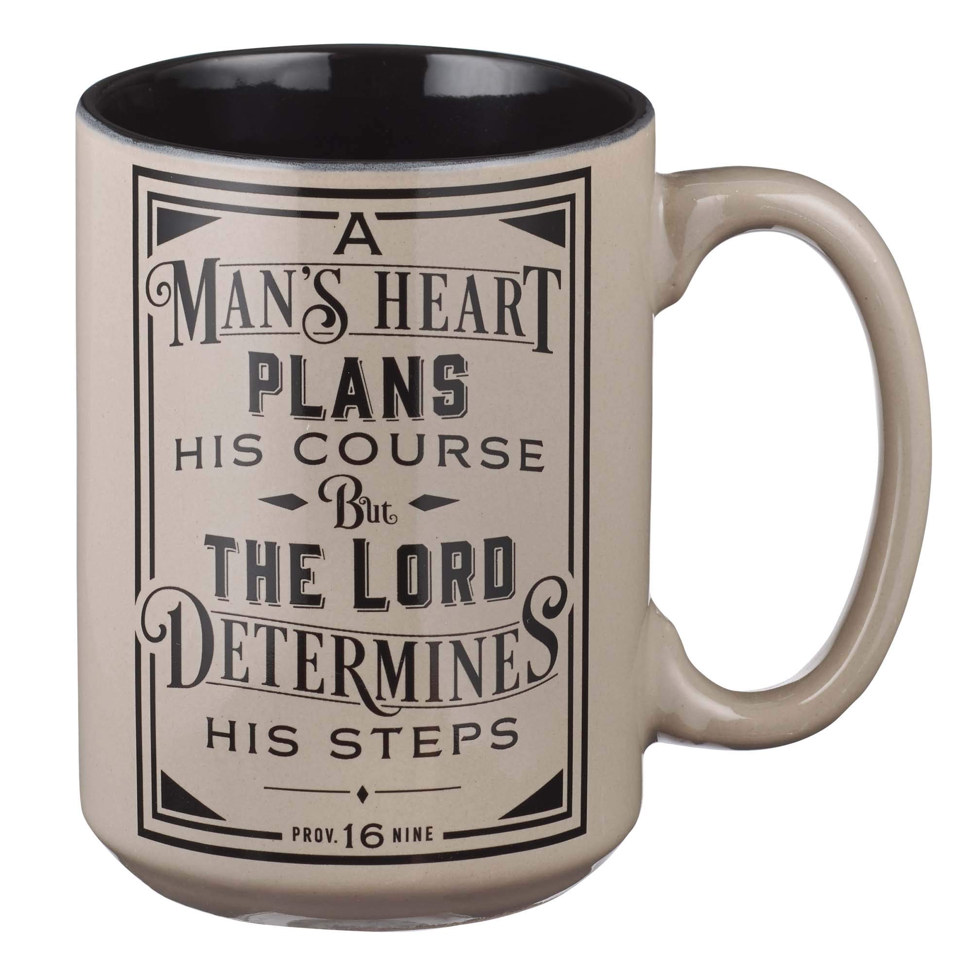 Beige ceramic mug with black interior, featuring Proverbs 16:9 inscription: “A man’s heart plans his course, but the Lord determines his steps.”