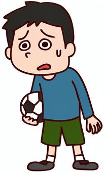 Worried boy holding a soccer ball, sweating with anxious expression.