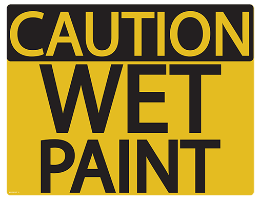Yellow caution sign with black text reading "CAUTION WET PAINT" in bold uppercase letters.