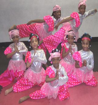 Children’s Dance Performance in Pink Polka-Dot Costumes | Cultural Celebration