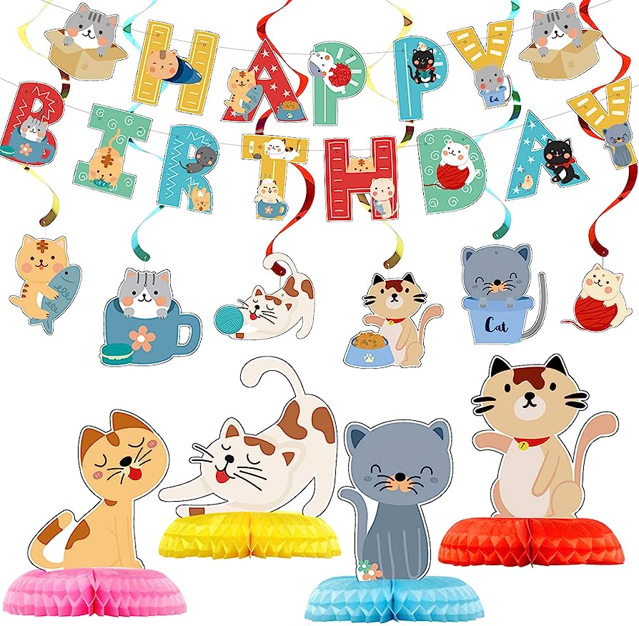 Colorful cat-themed birthday party decorations including banner, hanging swirls, and 3D table centerpieces.