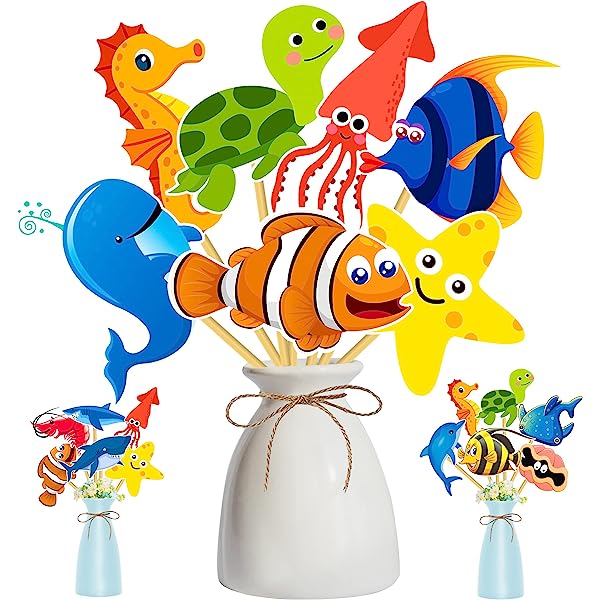 Colorful cartoon sea creature party picks in a white vase, including clownfish, starfish, octopus, turtle, seahorse, whale, and angelfish.