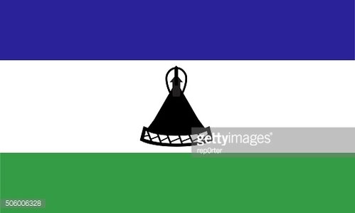 Flag of Lesotho featuring blue, white, and green horizontal stripes with a black Basotho hat centered on the white stripe.