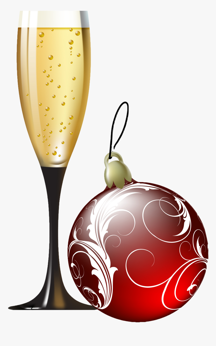 A champagne flute filled with bubbly golden liquid beside a red ornamental Christmas bauble with white swirl patterns.