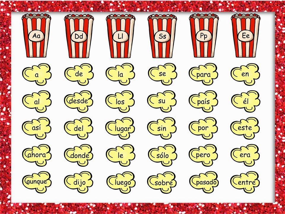 Spanish phonics learning chart with popcorn-themed letter groups and vocabulary clouds.