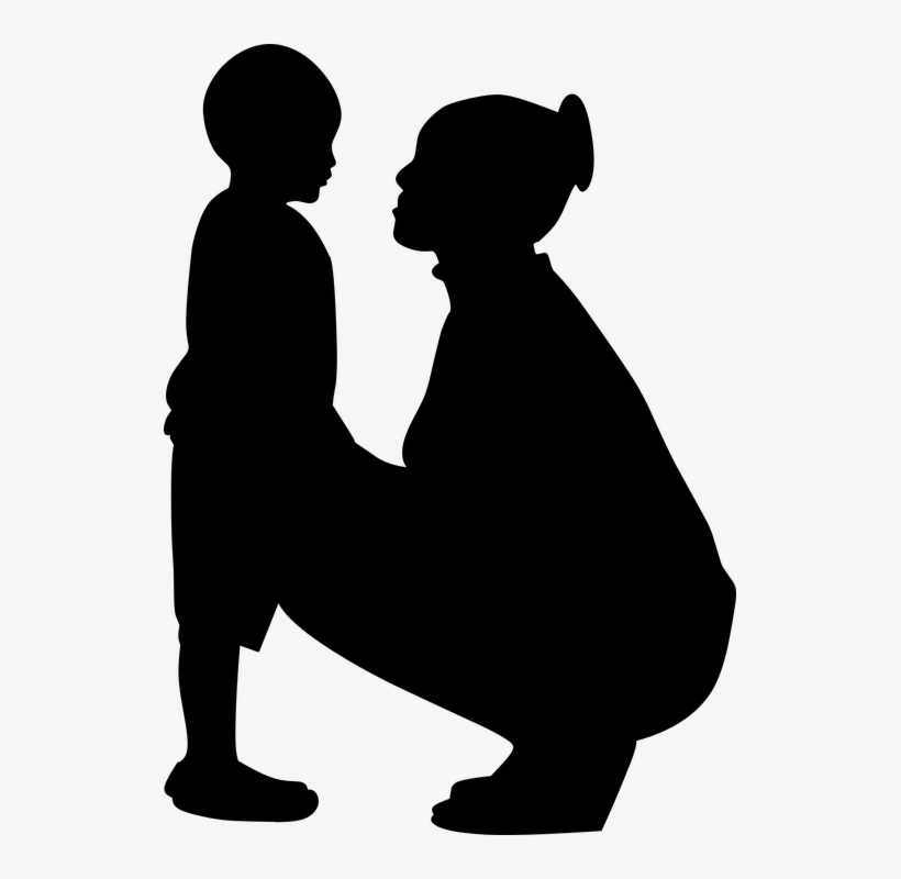 Silhouette of a woman kneeling to speak gently with a young child at eye level.