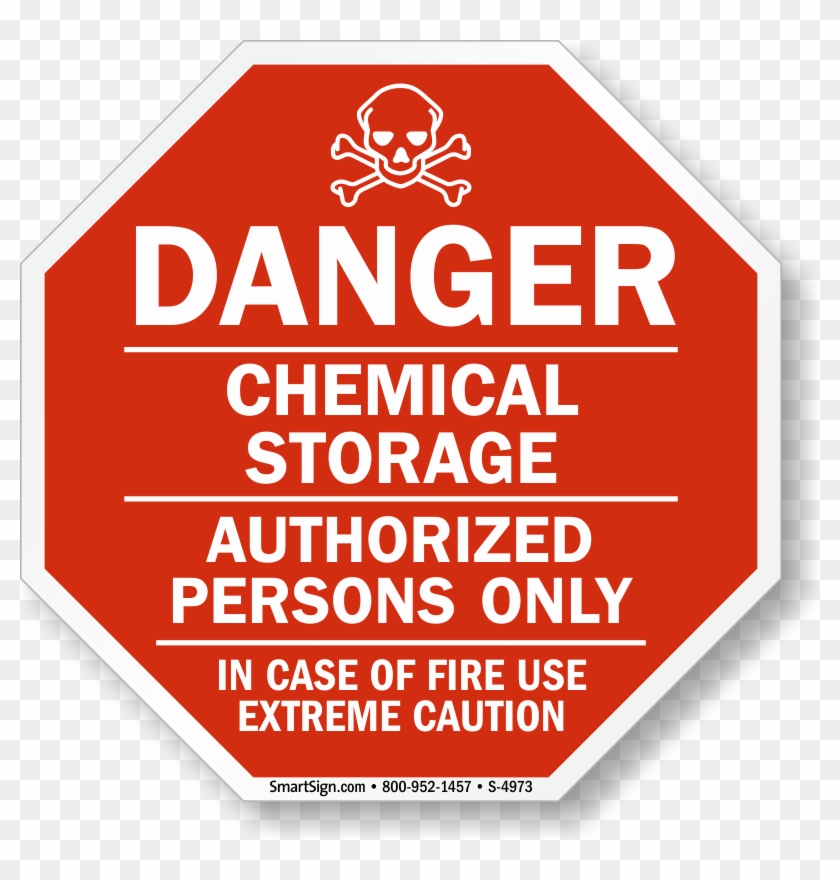 Red octagonal danger sign warning of chemical storage, authorized persons only, with skull and crossbones symbol.