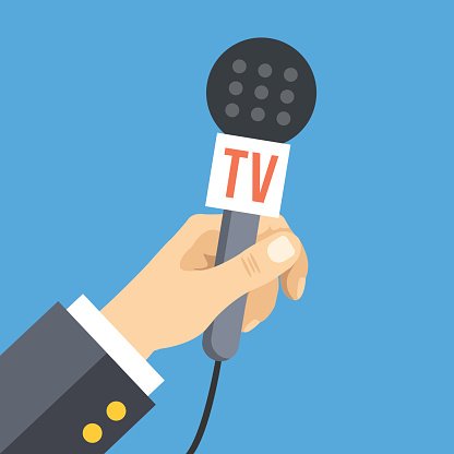 Hand holding a TV-branded microphone against a blue background, symbolizing broadcast journalism or media reporting.