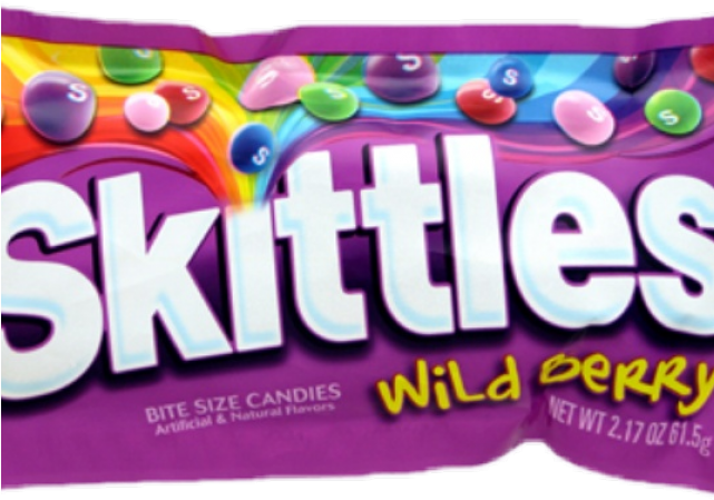 Skittles Wild Berry bite-size candies in a vibrant purple package with colorful fruit-flavored pieces.