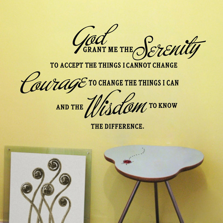 Serenity Prayer wall decal on yellow wall beside abstract art and ladybug-decorated side table.