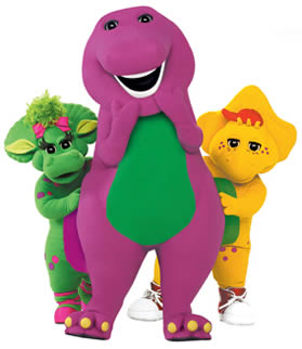 Barney the purple dinosaur stands smiling with Baby Bop and BJ, three beloved characters from the children's TV show.