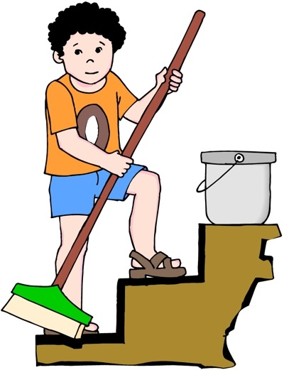 A young boy in an orange shirt and blue shorts sweeps stairs with a broom, standing beside a bucket.