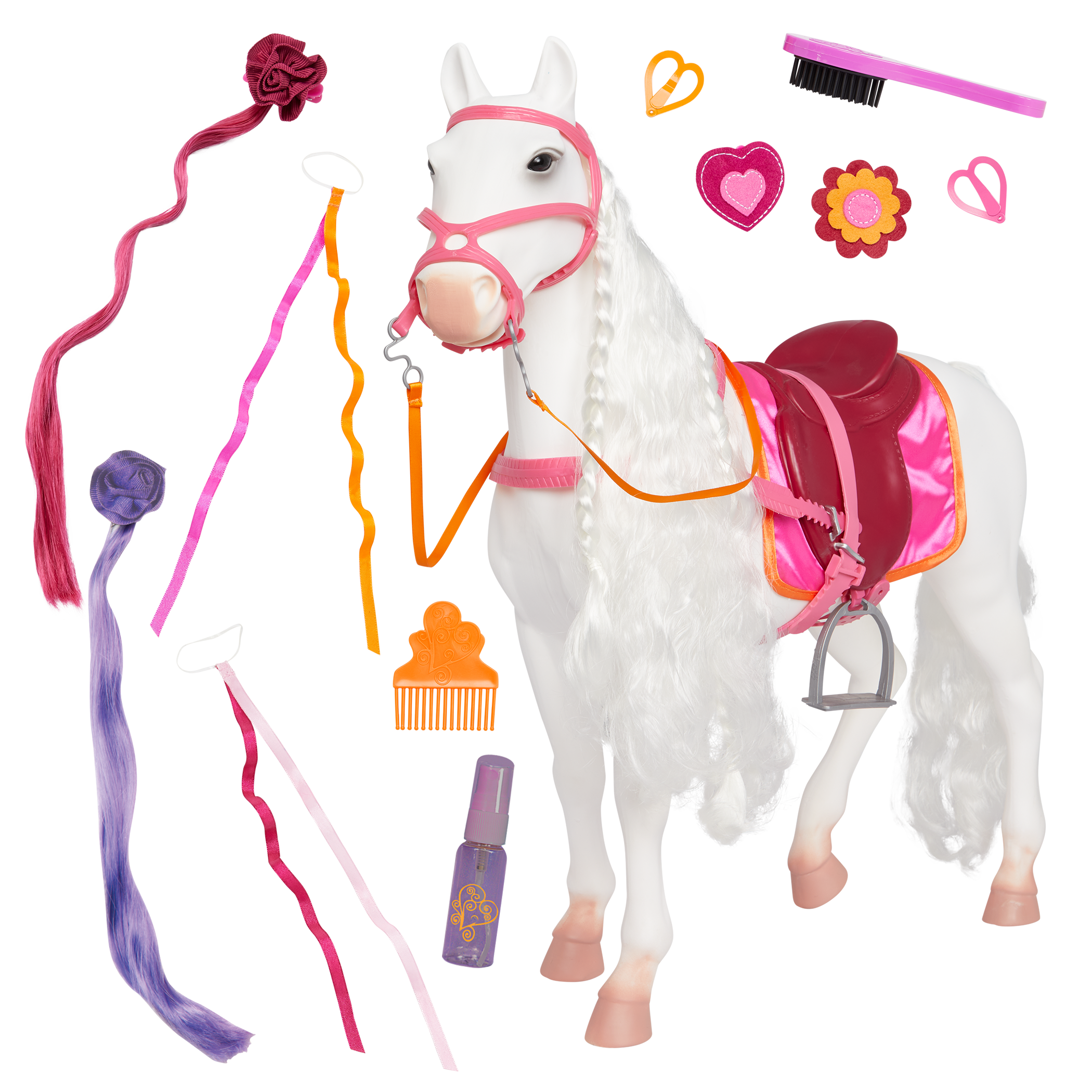 White toy horse with pink tack, braided mane, and grooming accessories including ribbons, comb, brush, and spray bottle.