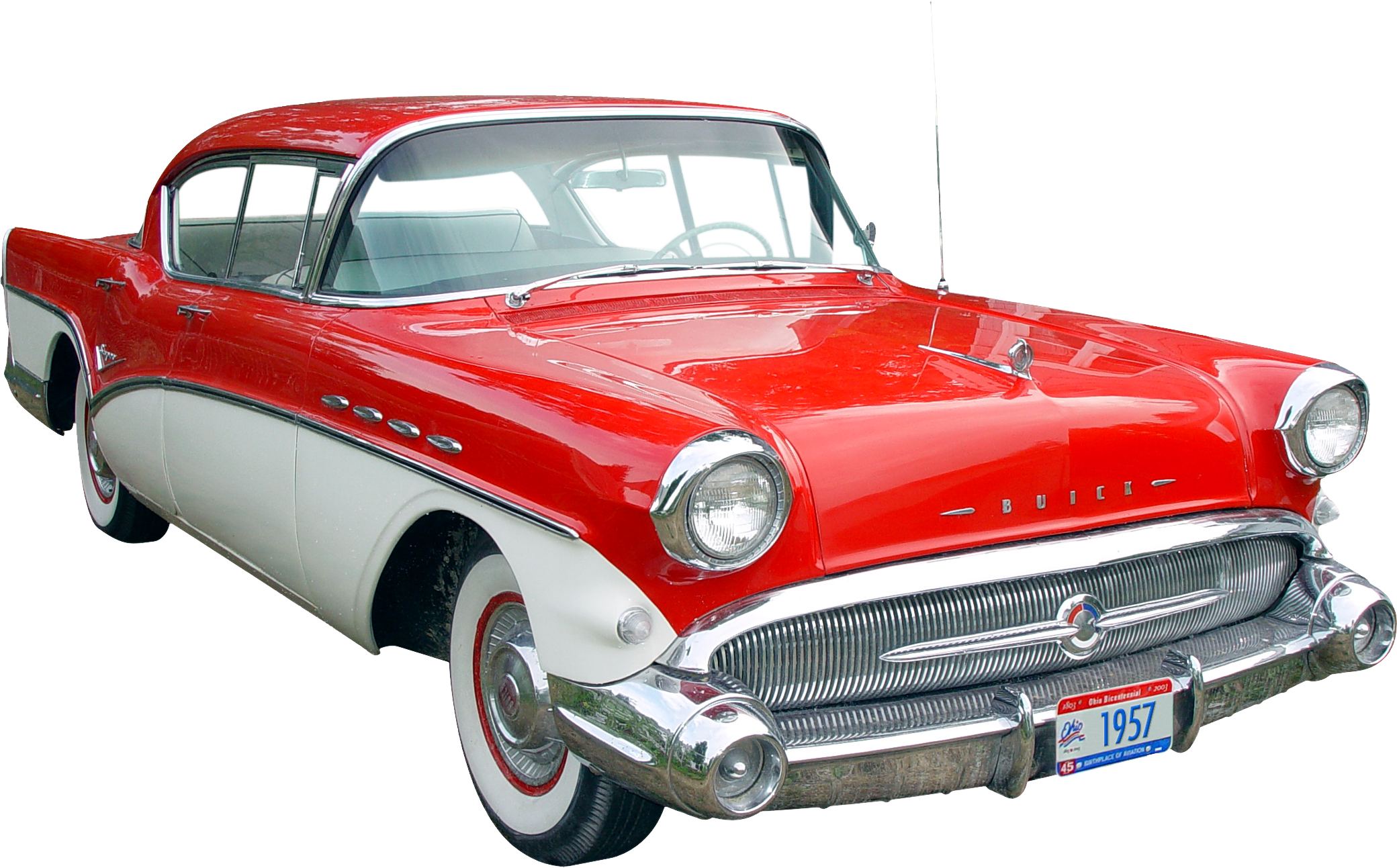 1957 Buick Special two-tone red and white classic American sedan with chrome grille and whitewall tires.